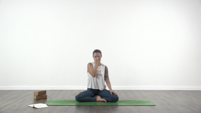 Yogi is practising yoga on a blue yoga mat on white background